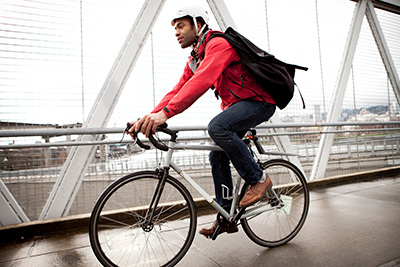 Man biking across a bridge