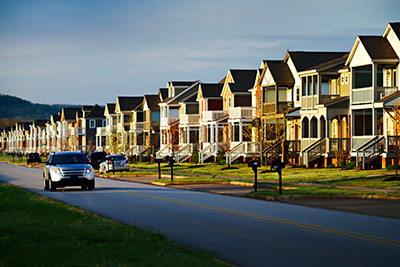 Car driving on a suburban street